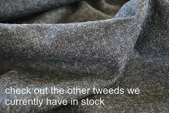 Tweed material by the metre in light brown/beige with windowpane in blue fabric