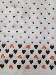 Vintage Border Fabric, 2yds, 36″ wide, white with orange clovers, brown hearts