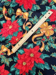 Gold Ribbons Red Poinsettias Green Holly on Black Christmas Cotton Fabric 58″W