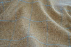 Tweed material by the metre in light brown/beige with windowpane in blue fabric