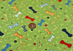 Colorful Dog Bones * on Green * SSI * 100% Cotton Remnant * 8″ x 22″
