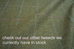 Tweed material by the metre in light brown/beige with windowpane in blue fabric