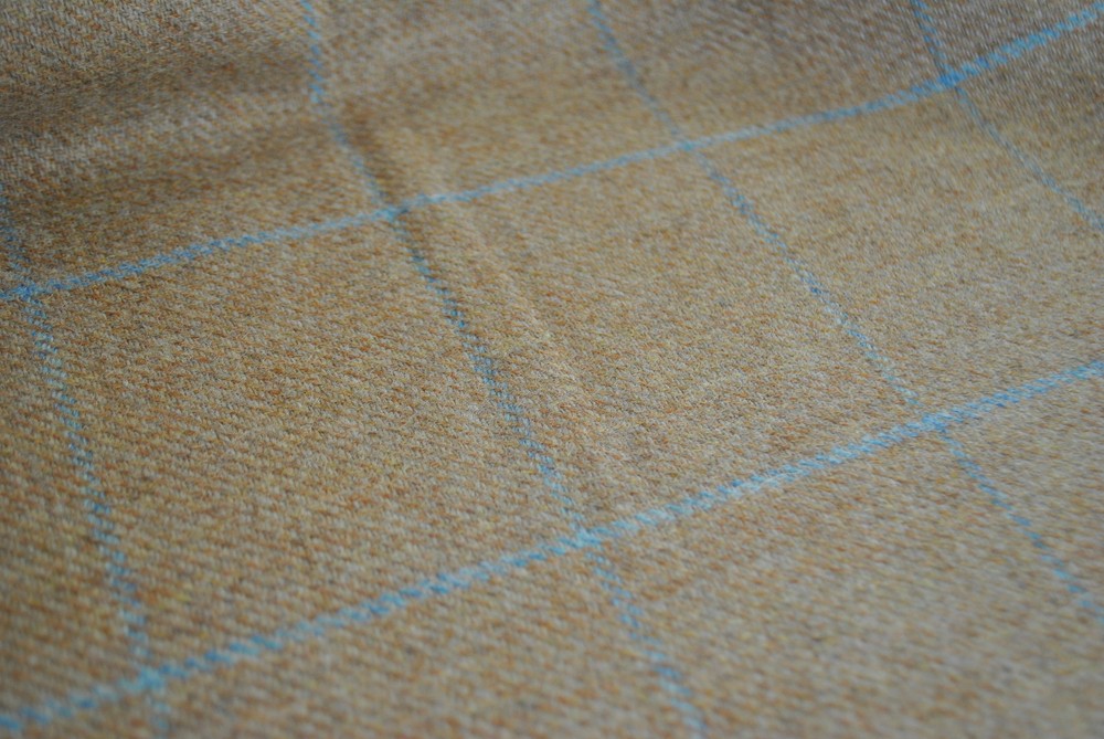 Tweed material by the metre in light brown/beige with windowpane in blue fabric