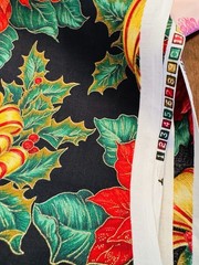 Gold Ribbons Red Poinsettias Green Holly on Black Christmas Cotton Fabric 58″W