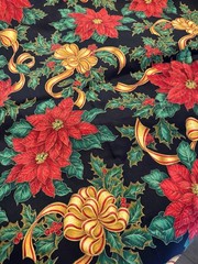 Gold Ribbons Red Poinsettias Green Holly on Black Christmas Cotton Fabric 58″W