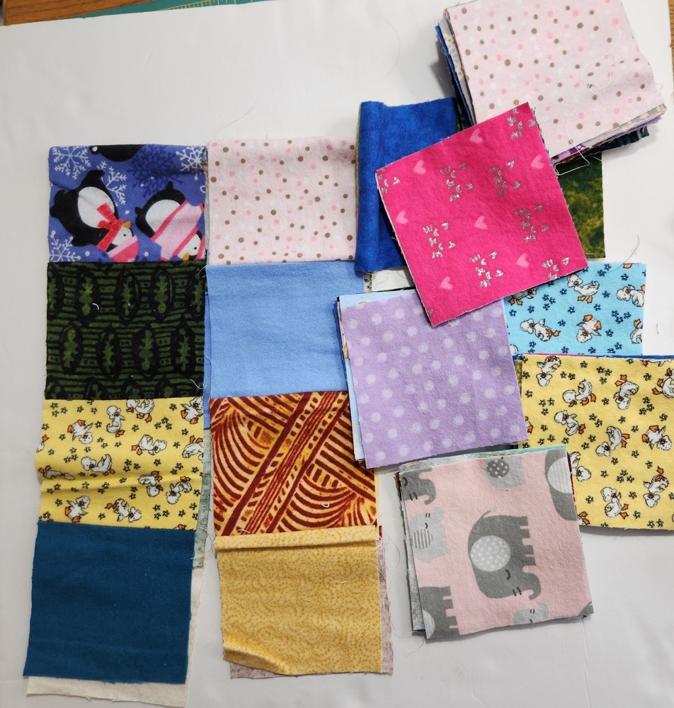Scrap Lot of Flannel Squares (56) 4.5″ x 4.5″ & (2) 20″ Strips Mostly Kid Prints