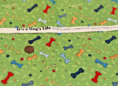 Colorful Dog Bones * on Green * SSI * 100% Cotton Remnant * 8″ x 22″